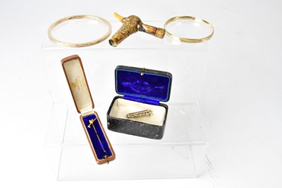 Lot 1320 - A 9ct yellow and white gold stick pin set with...