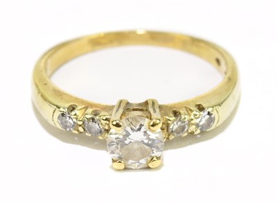 Lot 1046 - A 14ct yellow gold and diamond solitaire ring,...