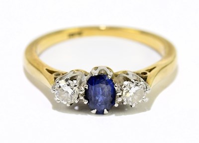 Lot 1153 - An 18ct yellow gold sapphire and diamond three...