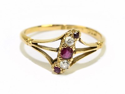 Lot 1155 - An 18ct yellow gold ruby and diamond five...
