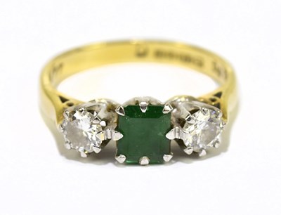 Lot 1044 - An 18ct yellow gold emerald and diamond ring,...