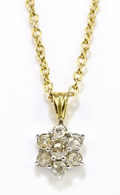 Lot 1045 - An white and yellow metal set seven stone...