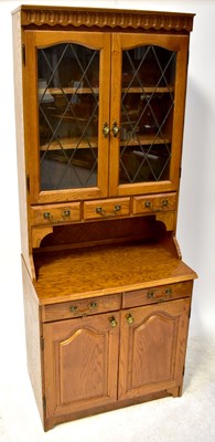 Lot 14 - A 20th century oak dresser with astragal...