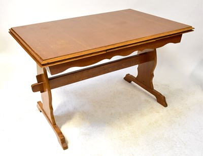 Lot 15 - A 20th century oak draw-leaf table in the...