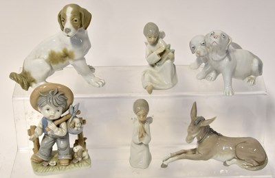Lot 137 - Six ceramic figures comprising a Lladrό...