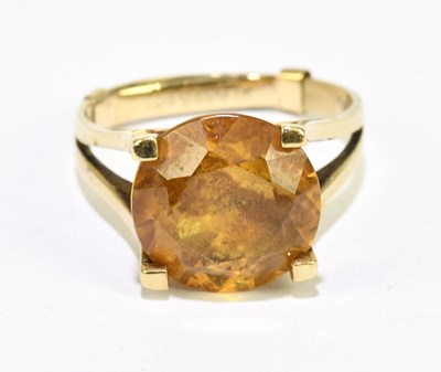 Lot 1081 - A 9ct yellow gold citrine set dress ring, size...