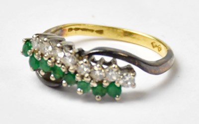 Lot 1138 - An 18ct yellow gold ring set with a double...