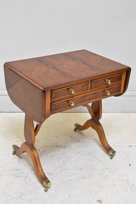 Lot 259 - A reproduction walnut drop-leaf three drawer...