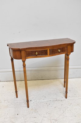 Lot 159 - A reproduction yew wood two drawer console...