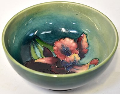 Lot 149 - MOORCROFT; an 'Iris' pattern bowl of blue...