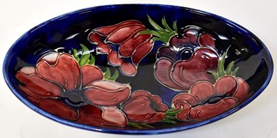 Lot 143 - MOORCROFT; an 'Anemone' pattern oval bowl of...