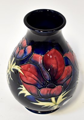 Lot 144 - MOORCROFT; an 'Anemone' pattern vase of...