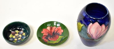 Lot 156 - MOORCROFT; three pieces of pottery comprising...