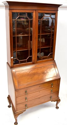 Lot 53 - A Georgian-style mahogany bureau bookcase, the...