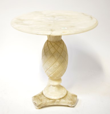 Lot 68 - An alabaster side table, with circular top and...