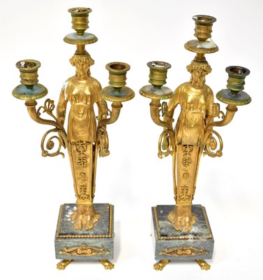 Lot 1032 - A pair of French Empire style gilt metal three-...