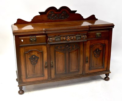 Lot 8 - An early 20th century walnut breakfront...