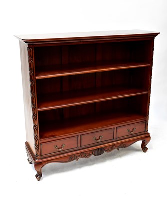 Lot 28 - A reproduction mahogany open bookcase with two...