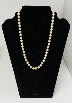 Lot 573 - GARRARD; a single cultured pearl necklace with...