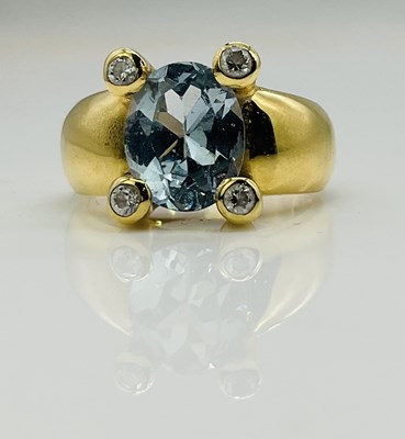 Lot 597 - A yellow metal aquamarine and diamond ring,...