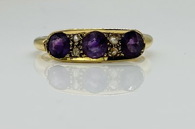 Lot 599 - An 18ct yellow gold amethyst and diamond chip...