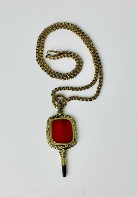 Lot 610 - A 9ct yellow gold chain suspending a yellow...