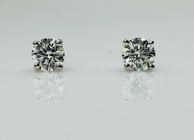Lot 592 - A pair of platinum diamond ear studs, the four...