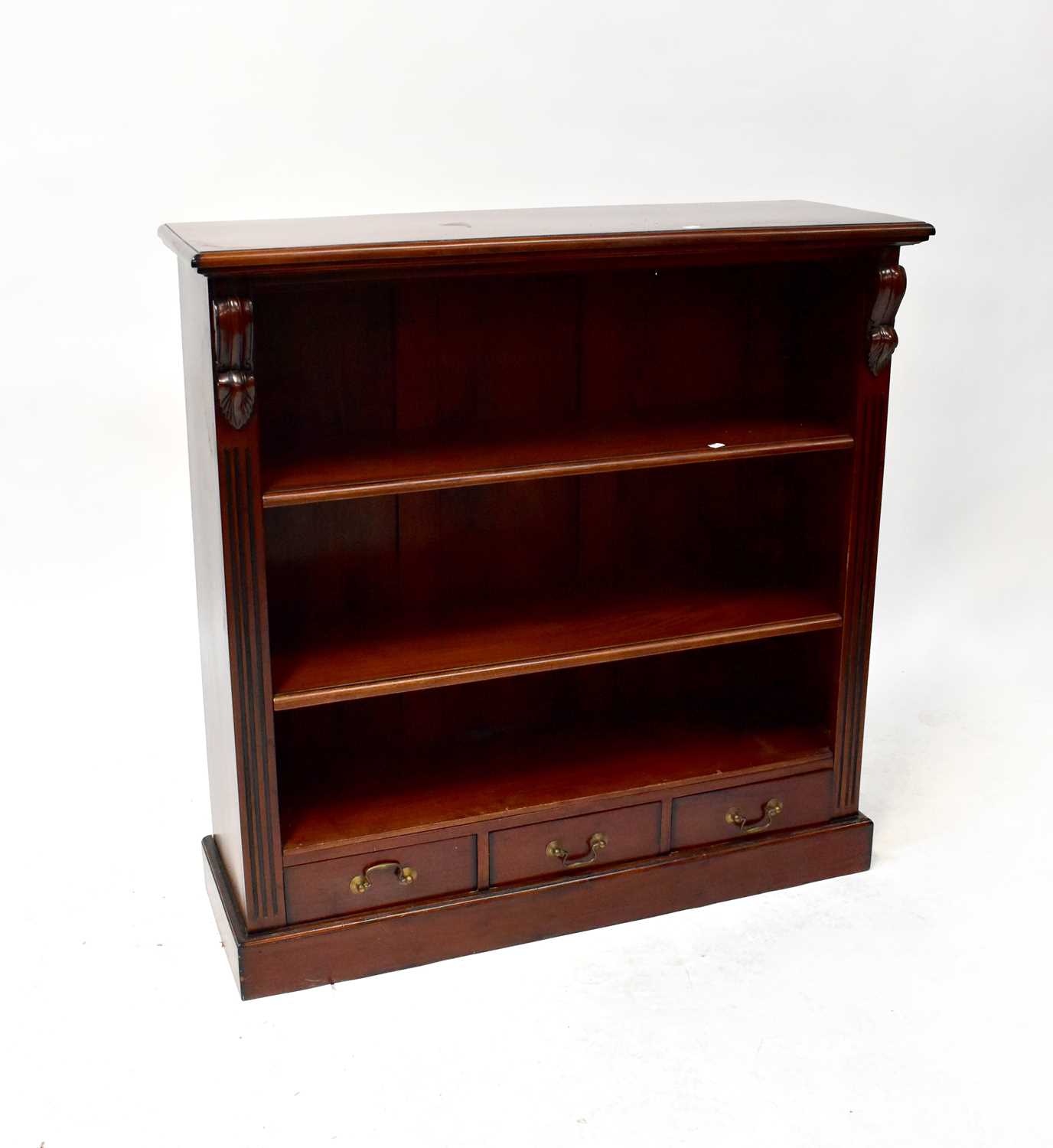 Lot 27 A reproduction mahogany open bookcase with