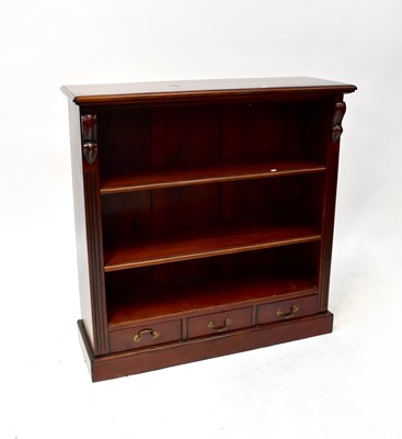 Lot 27 - A reproduction mahogany open bookcase with two...