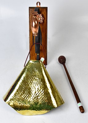 Lot 272 - A wall-mounting dinner gong, with black scroll...