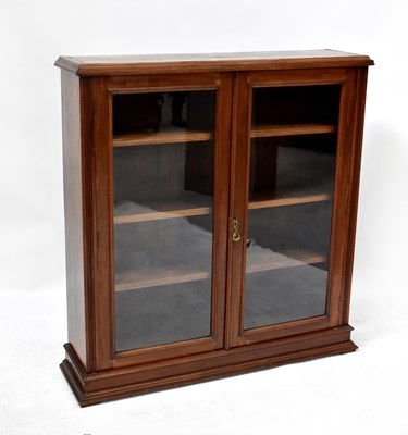 Lot 26 - An early 20th century mahogany glazed bookcase...