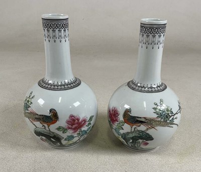Lot 435 - A pair of Famille Rose pattern Chinese vases,...
