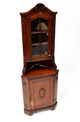 Lot 72 - A reproduction mahogany free-standing corner...