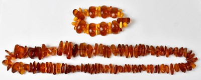 Lot 1348 - A continuous amber-style necklace with...