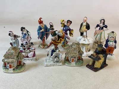 Lot 403 - A quantity of Staffordshire cottages and...