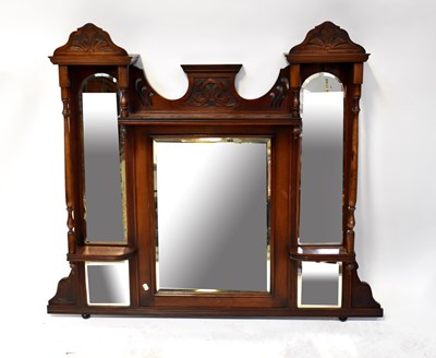 Lot 78 - An early 20th century walnut overmantel mirror...