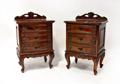 Lot 22 - A pair of reproduction carved mahogany...