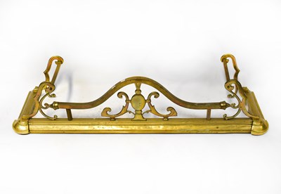 Lot 193 - A 19th century brass fire fender with arched...