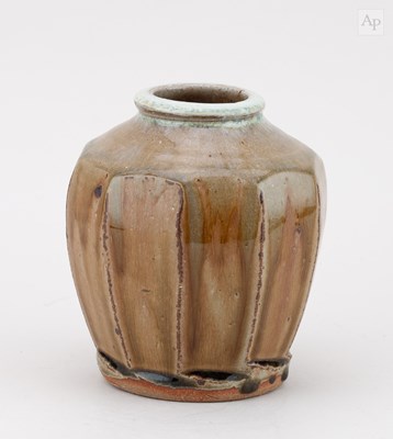 Lot 508 - MIKE DODD (born 1943); a faceted stoneware jar...