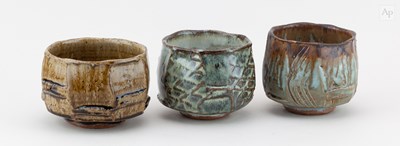 Lot 209 - BEN DODD; a trio of faceted stoneware chawan...