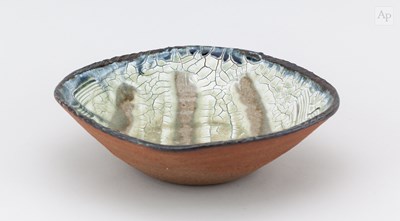 Lot 207 - BEN DODD; a shallow stoneware bowl covered in...