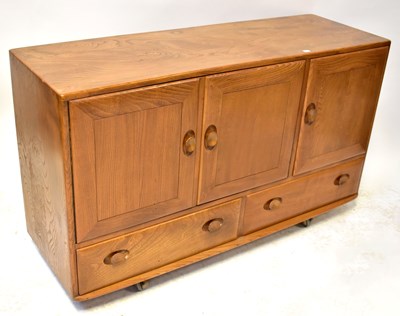 Lot 4 - ERCOL; an elm sideboard comprising three...