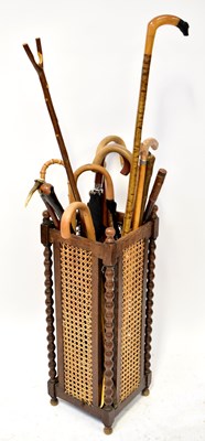 Lot 312 - A collection of walking sticks, shepherd's...