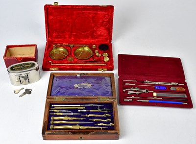 Lot 316 - A cased set of jewellers' balance scales in a...