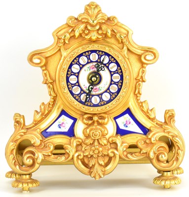 Lot 127 - A modern French-style mantel clock of...