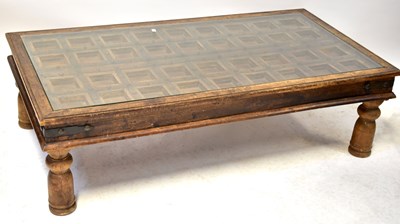 Lot 67 - A Continental wooden iron-bound door, framed...