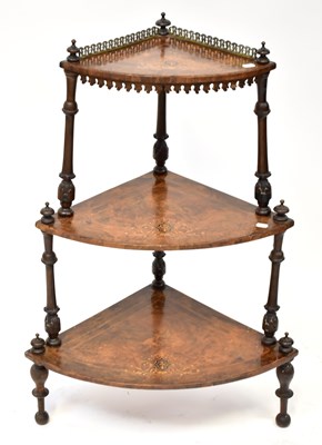 Lot 44 - A Victorian inlaid walnut three-tier whatnot,...