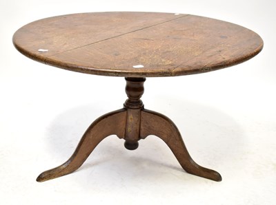 Lot 35 - A 19th century oak circular tilt-top table, on...