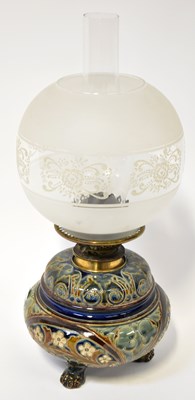 Lot 170 - DOULTON LAMBETH; an oil lamp with scroll and...