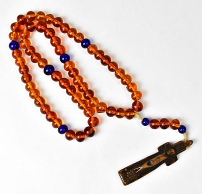 Lot 810 - An amber and blue glass bead rosary with Irish...